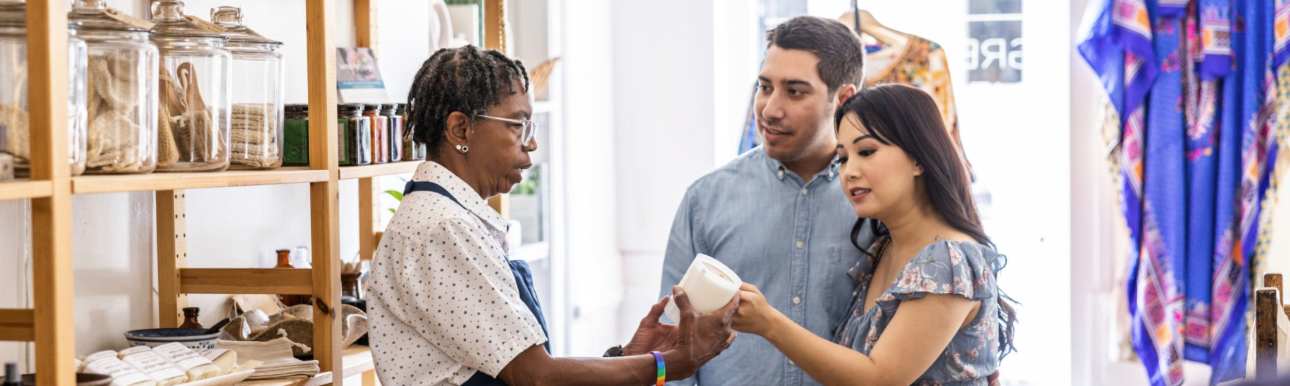 smiling-restaurant-owners-looking-at-laptop